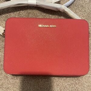 Michael Kors crossbody bag, brand new, tags and orginal plastic still attached.